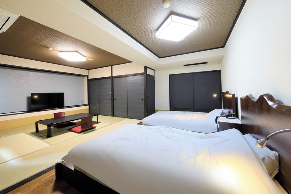Deluxe Twin Room, Non Smoking, Private Bathroom (Japanese-Western with Open Air Bath) | In-room safe, desk, free WiFi, bed sheets