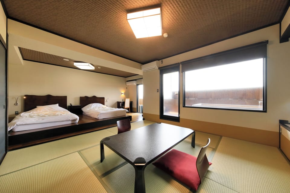 Deluxe Twin Room, Non Smoking, Private Bathroom (Japanese-Western with Open Air Bath) | In-room safe, desk, free WiFi, bed sheets