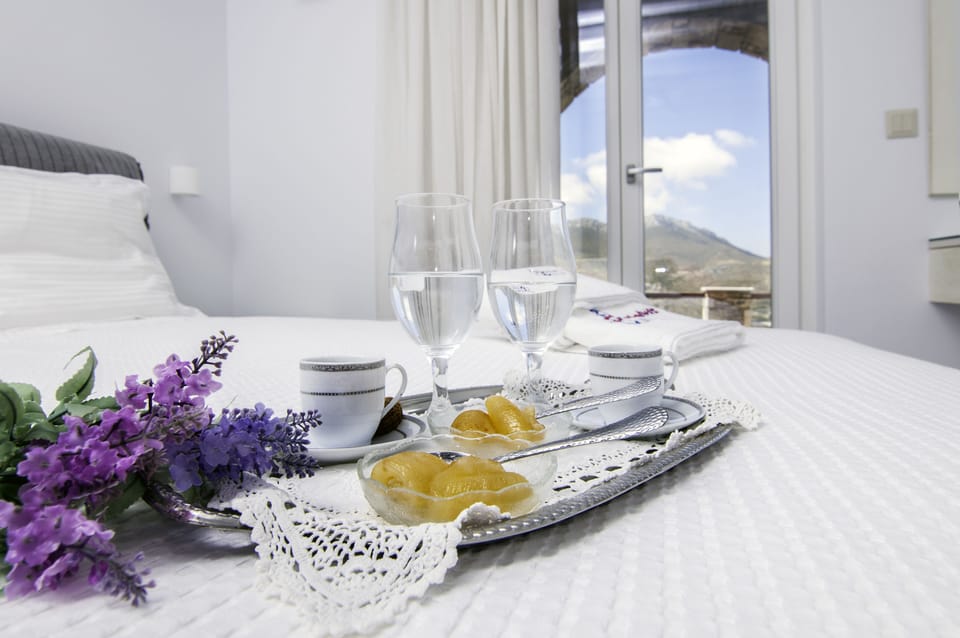 Deluxe Triple Room, Sea View | Premium bedding, in-room safe, desk, blackout drapes