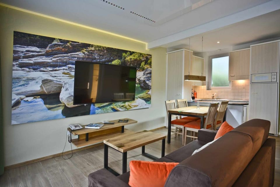 Comfort Studio | Living area | 65-inch flat-screen TV with cable channels, TV, foosball