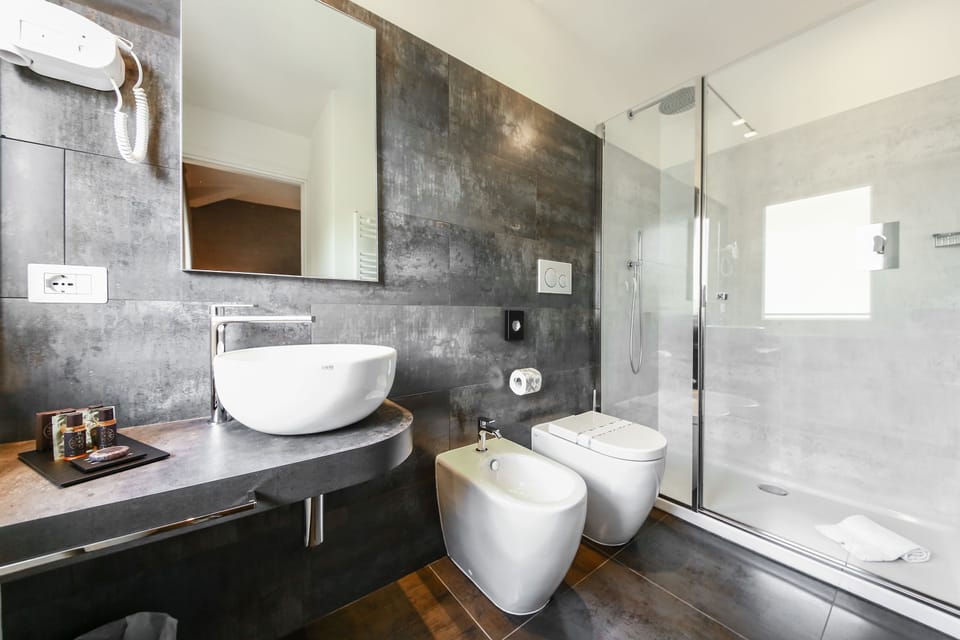 Designer toiletries, hair dryer, bidet, towels