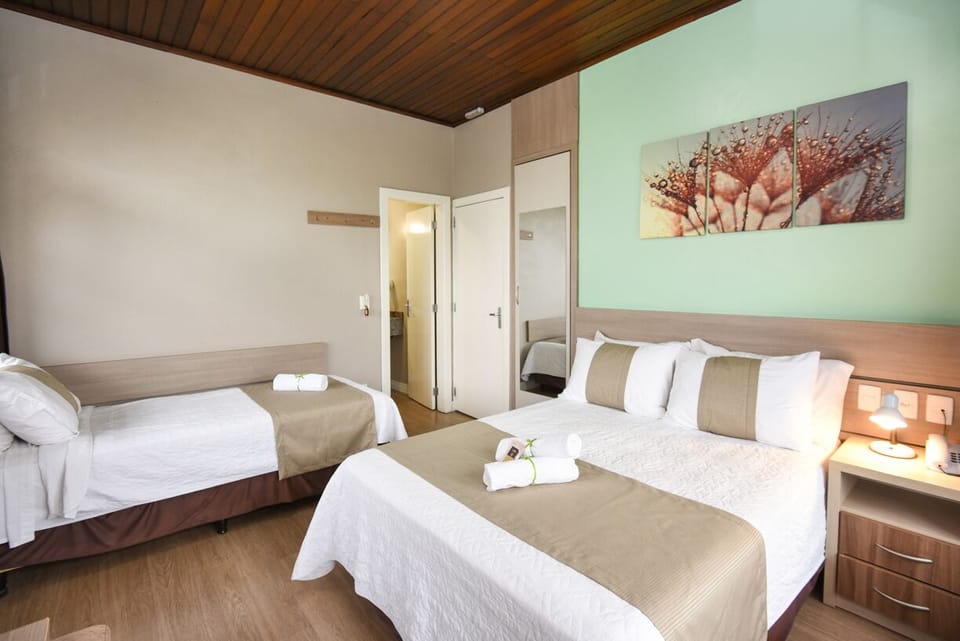 Deluxe Triple Room | Minibar, desk, blackout drapes, soundproofing