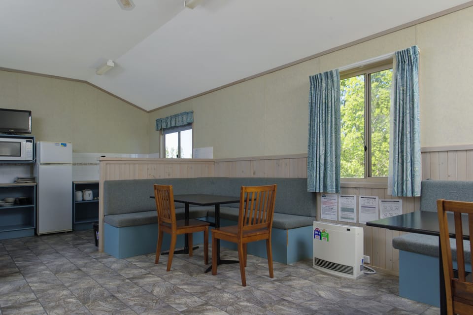 Bungalow (Bedding Linen Not Provided) | Living area | 36-inch flat-screen TV with digital channels, TV, DVD player