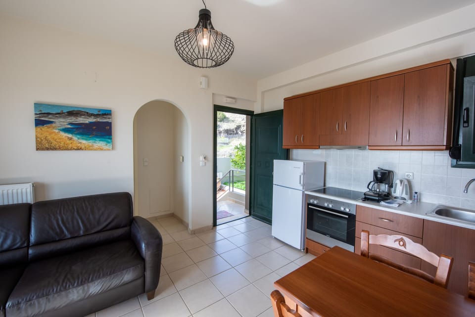 Classic Suite, 1 Bedroom, Sea View (1st Floor) | Private kitchen | Espresso maker, coffee/tea maker, full-size fridge, oven