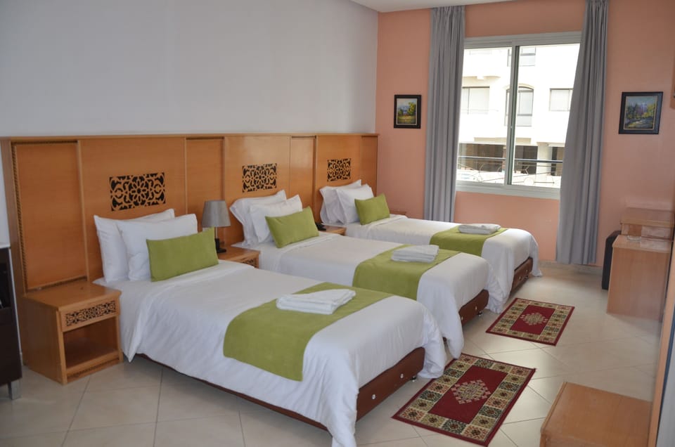 Standard Triple Room, Sea View | Desk, blackout drapes, soundproofing, free rollaway beds