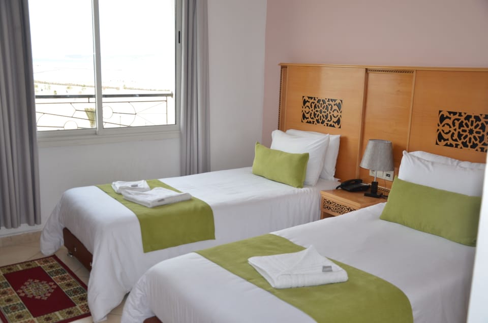 Twin Room, City View | Desk, blackout drapes, soundproofing, free rollaway beds