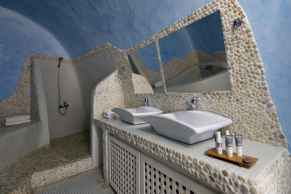Gods Divine Suite indoor pool with hot tub and Caldera View | Bathroom sink