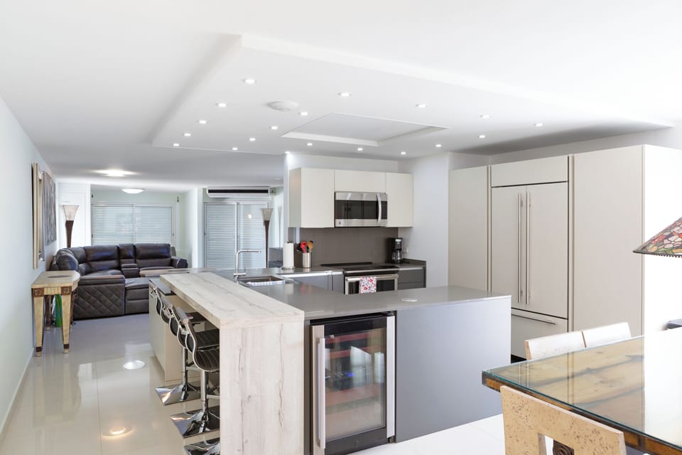 Penthouse Suite, 2 Kings 1 Queen | Private kitchen | Coffee/tea maker, full-size fridge, microwave, dishwasher