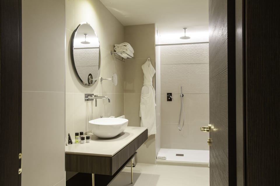 Shower, free toiletries, hair dryer, slippers