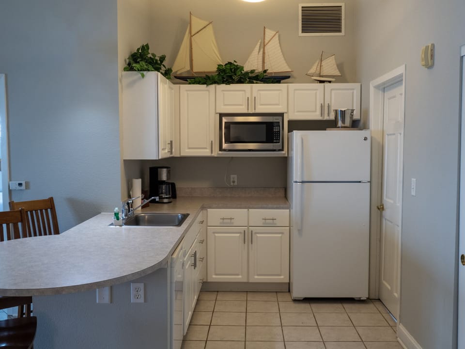Premier Suite, 2 Bedrooms, Lake View | Private kitchenette | Coffee/tea maker, full-size fridge, microwave, dishwasher