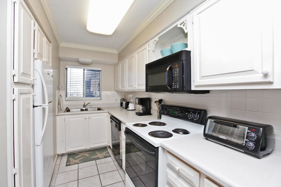 Two Bedroom Condo with a Sea View 820 | Private kitchen | Fridge, microwave, oven, stovetop