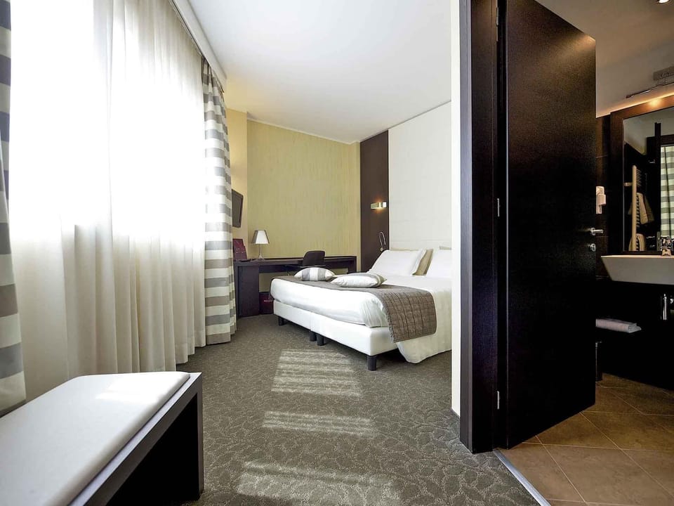 Premium bedding, down comforters, Select Comfort beds, minibar