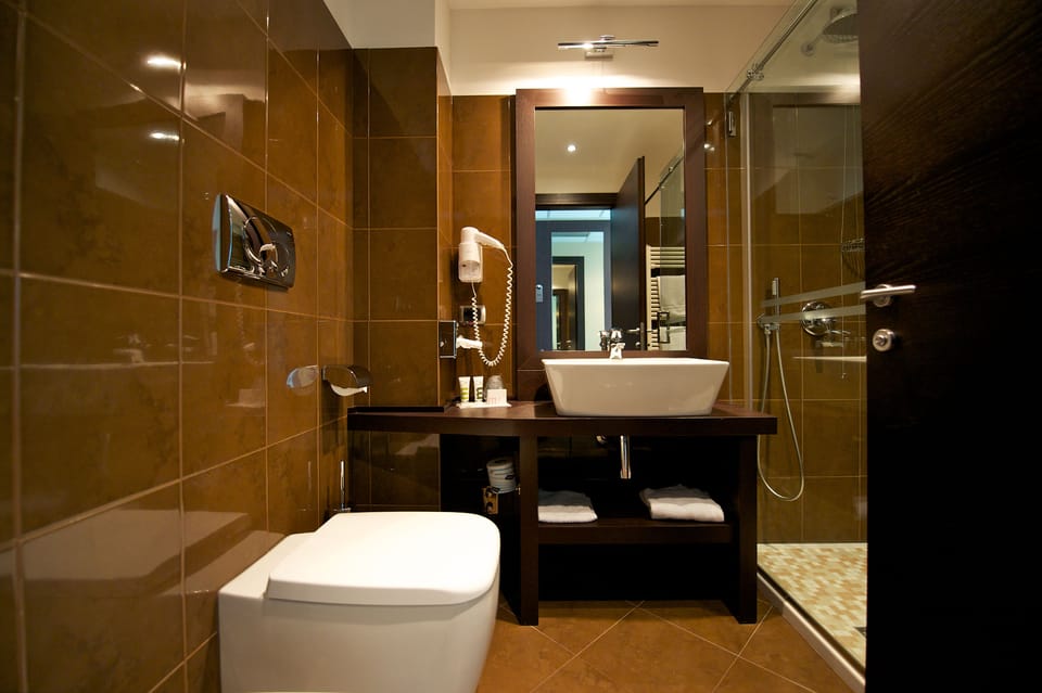 Shower, eco-friendly toiletries, hair dryer, bidet