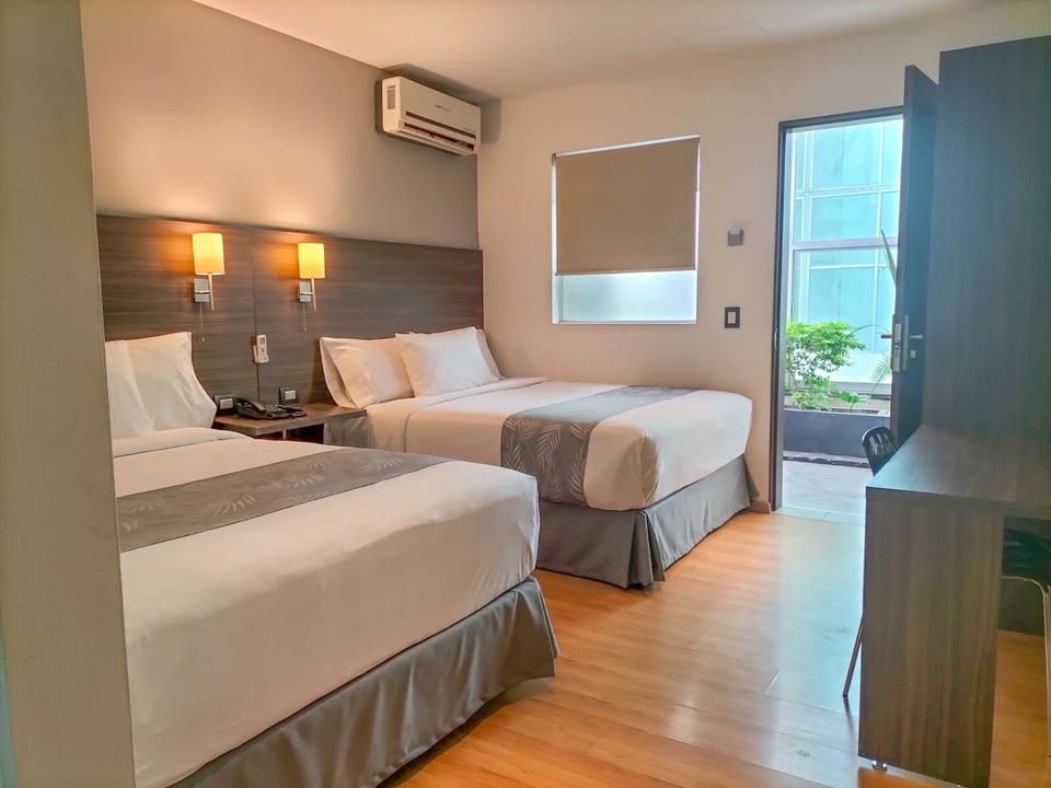 Superior Room, 2 Queen Beds | Down comforters, individually decorated, iron/ironing board, free WiFi