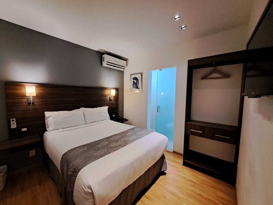 Standard Room | Down comforters, individually decorated, iron/ironing board, free WiFi