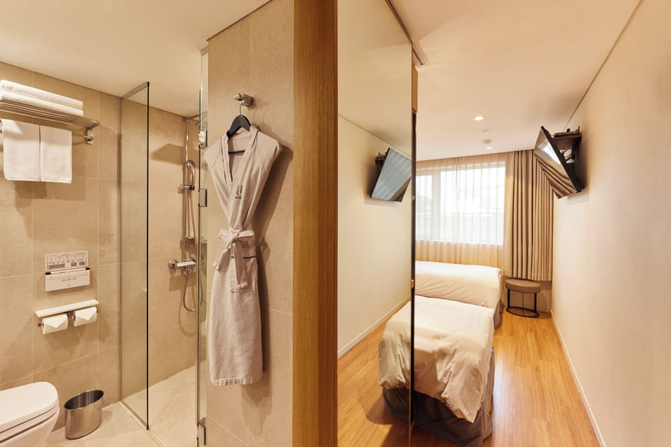 Hair dryer, bathrobes, bidet, towels