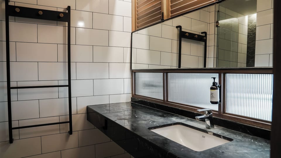 Deluxe Quadruple Room | Bathroom amenities | Shower, free toiletries, hair dryer, bathrobes