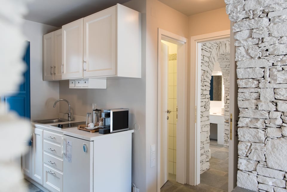 One Bedroom Suite with City View | Private kitchenette | Espresso maker, electric kettle, highchair