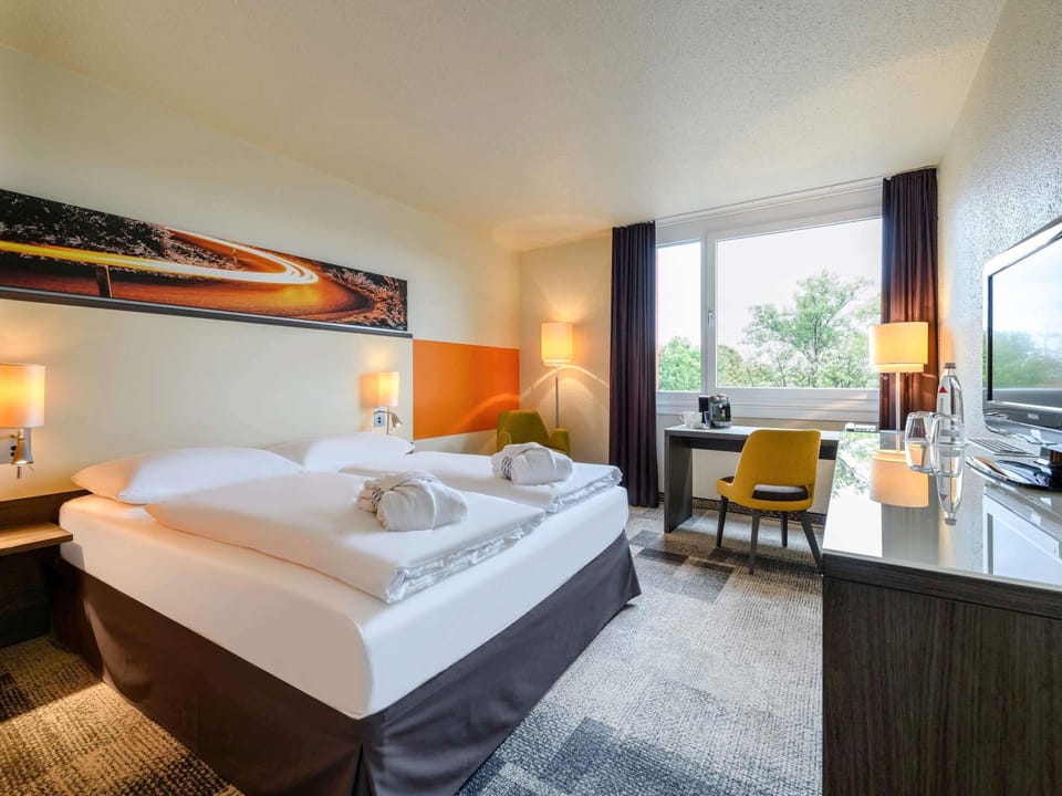 Premium bedding, down comforters, in-room safe, desk