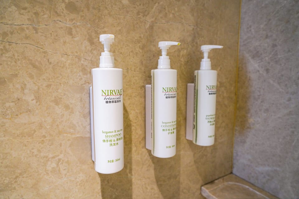 Premium Room, 1 King Bed | Bathroom | Combined shower/tub, free toiletries, hair dryer, bathrobes