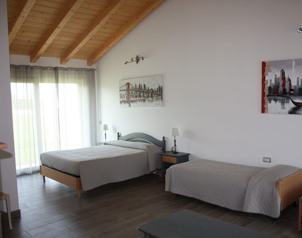 Family Triple Room, Private Bathroom, Garden View | In-room safe, blackout drapes, free WiFi, bed sheets