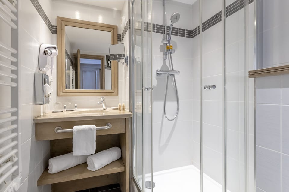Designer toiletries, hair dryer, bathrobes, slippers