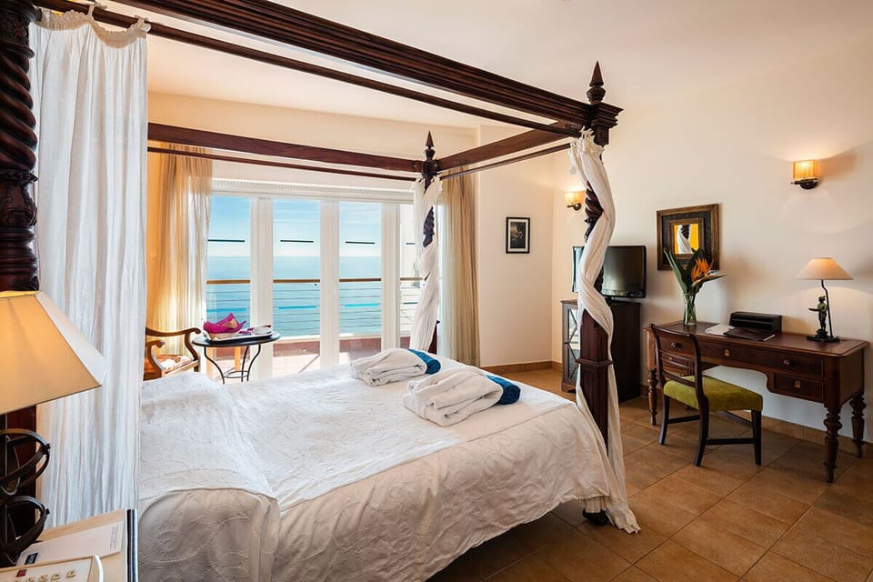 Deluxe Double Room, Sea View | Minibar, in-room safe, desk, blackout drapes