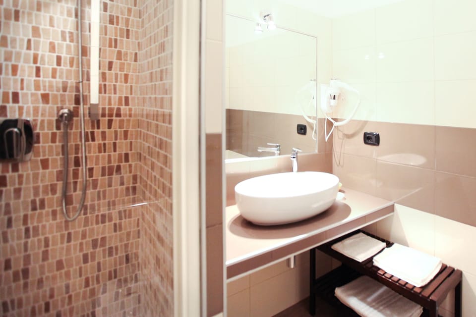 Shower, free toiletries, hair dryer, towels