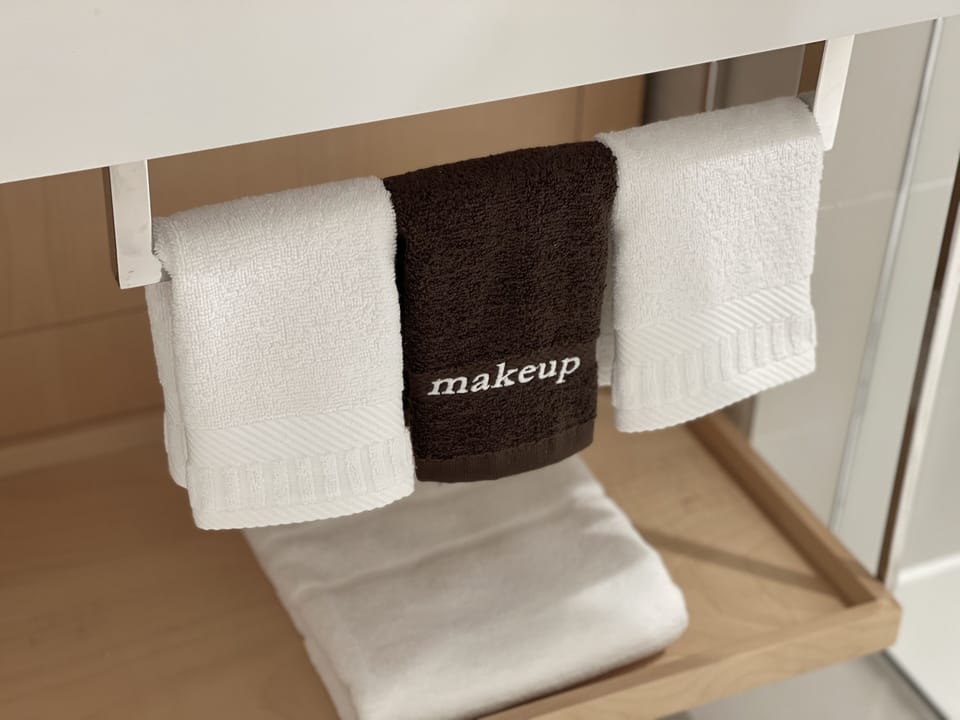 Shower, rainfall showerhead, designer toiletries, hair dryer