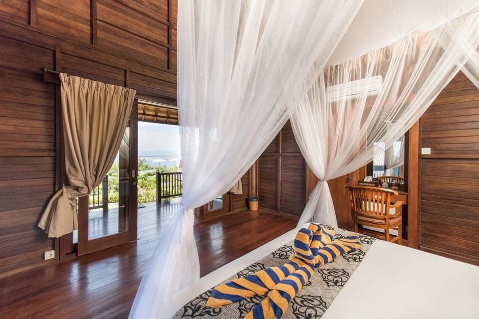 Bungalow, Garden View | Minibar, in-room safe, blackout drapes, free WiFi