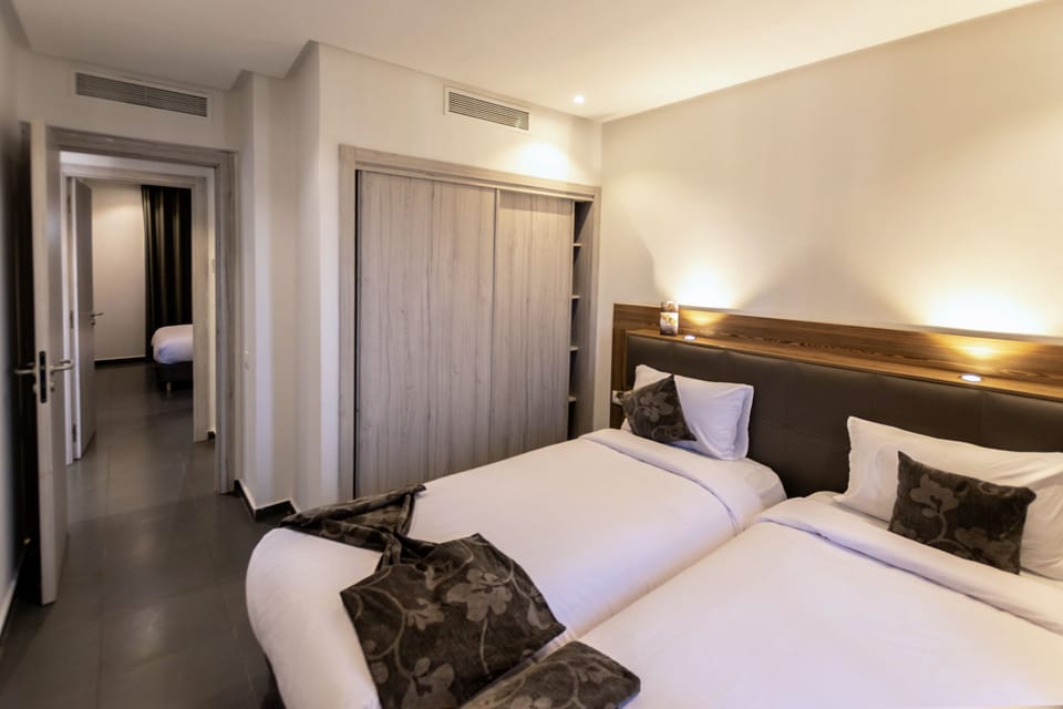 Senior Apartment, 2 Bedrooms | Premium bedding, in-room safe, blackout drapes, soundproofing