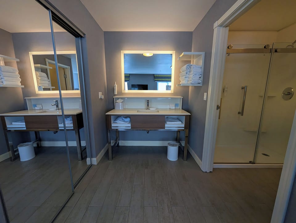 One king studio suite | Bathroom | Shower, free toiletries, hair dryer, towels