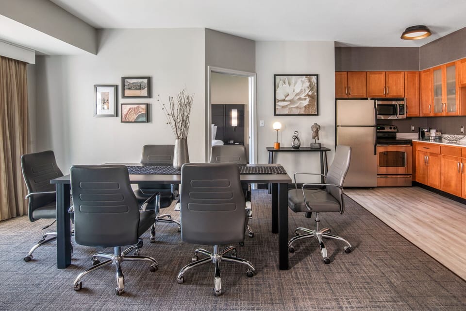 Premium bedding, desk, laptop workspace, blackout drapes