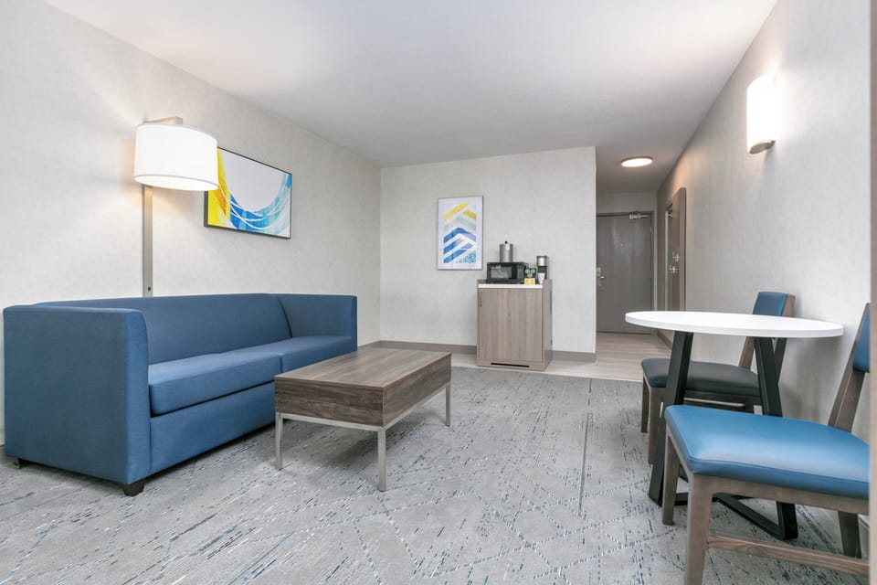 Suite, 1 King Bed, Roll-in Shower (Mobility Accessible) | Iron/ironing board, free cribs/infant beds, free WiFi, bed sheets