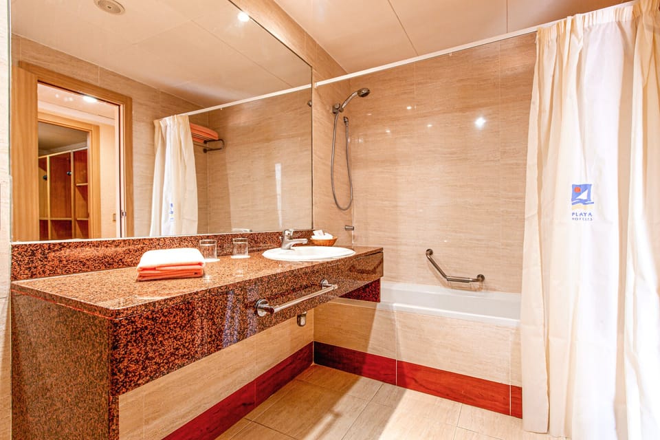 Deep soaking tub, eco-friendly toiletries, hair dryer, towels