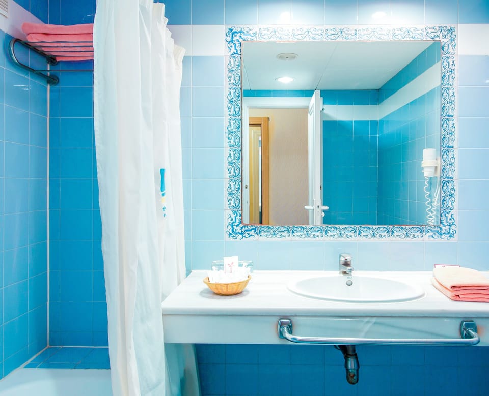 Deep soaking tub, eco-friendly toiletries, hair dryer, towels