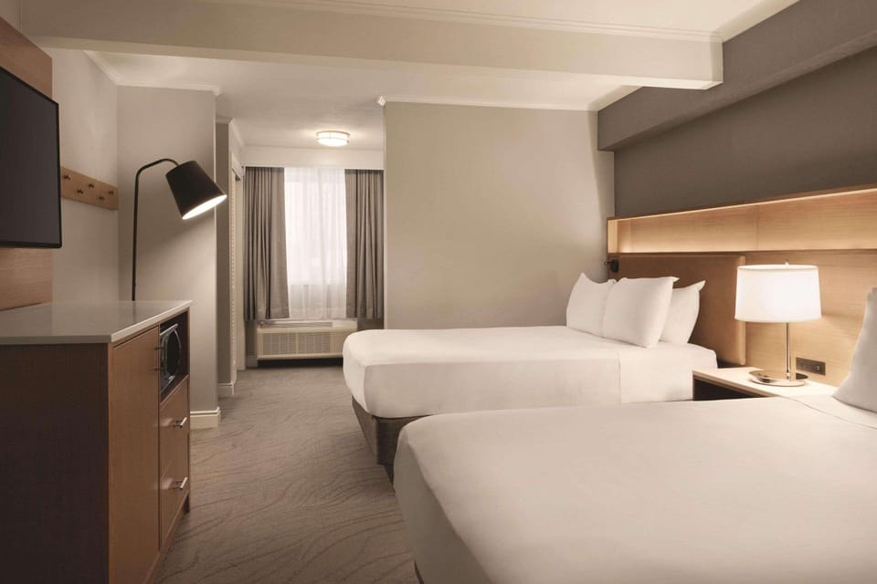 Hypo-allergenic bedding available, pillowtop beds, in-room safe, desk