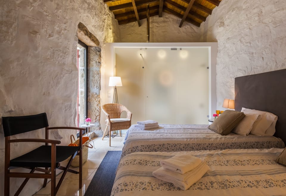 Superior Suite, Courtyard View | Minibar, laptop workspace, blackout drapes, soundproofing