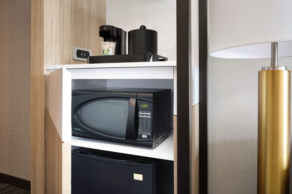 Premium bedding, desk, laptop workspace, blackout drapes