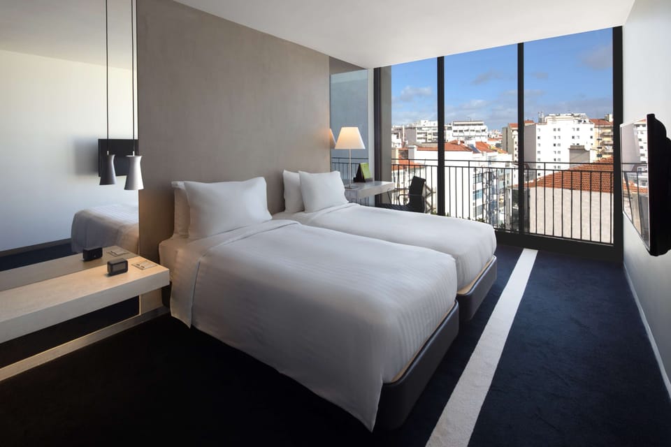 Twin Patio View Room with Balcony | Premium bedding, minibar, in-room safe, desk