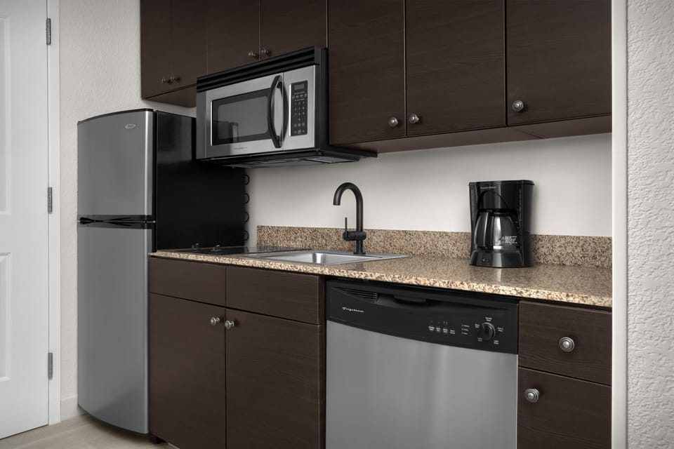 Studio, 2 Queen Beds | Private kitchen | Full-size fridge, microwave, stovetop, dishwasher