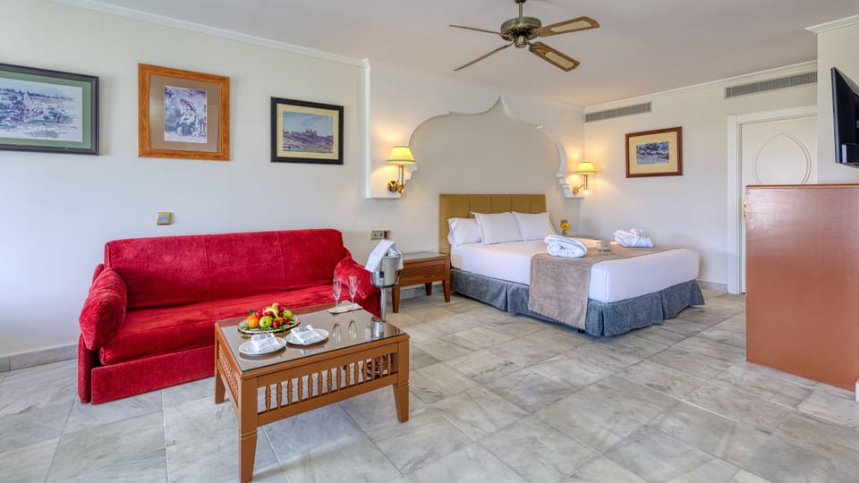 Junior Suite, Balcony | Living area | Flat-screen TV