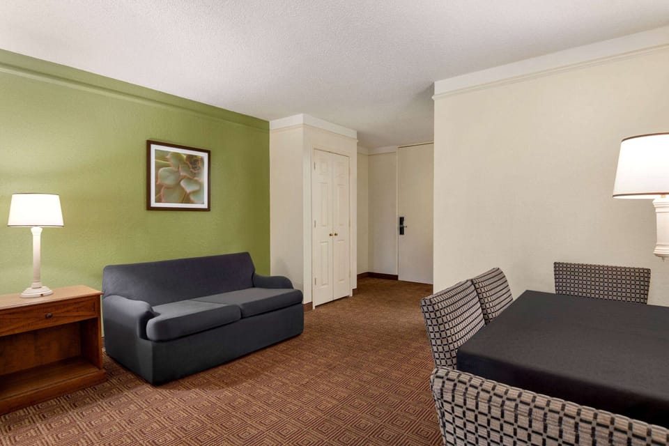 Family Suite, 1 Bedroom, Non Smoking (1 King Bed, 2 Double Beds) | Pillowtop beds, desk, laptop workspace, blackout drapes