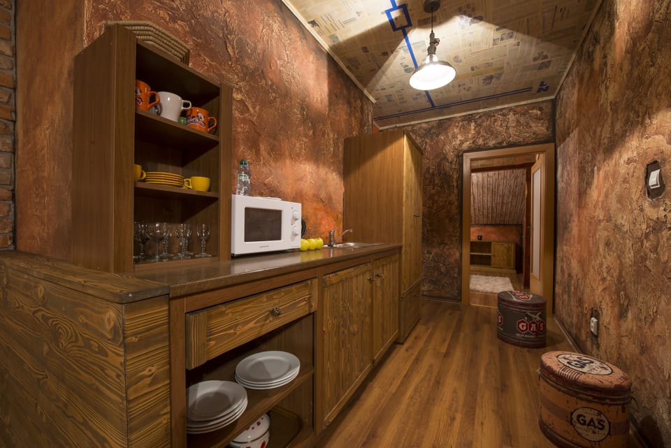 Deluxe Apartment, Kitchenette | Private kitchenette | Coffee/tea maker, electric kettle