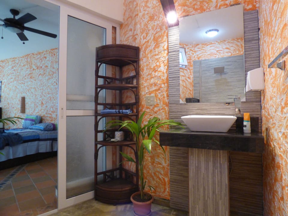 Apartment, 1 Double Bed | Bathroom | Shower, rainfall showerhead, free toiletries, towels