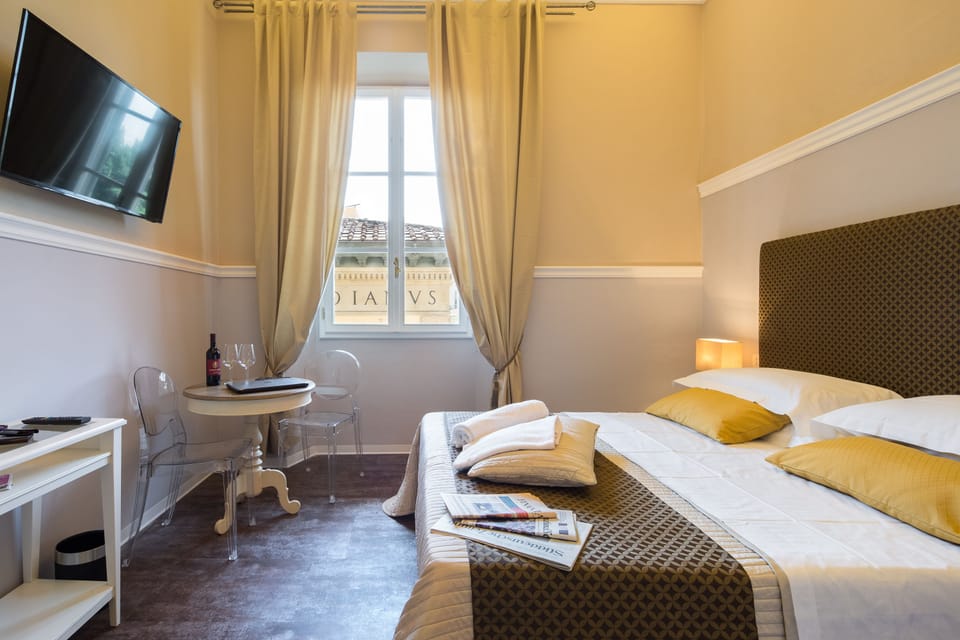 Standard Double Room | Minibar, in-room safe, desk, iron/ironing board