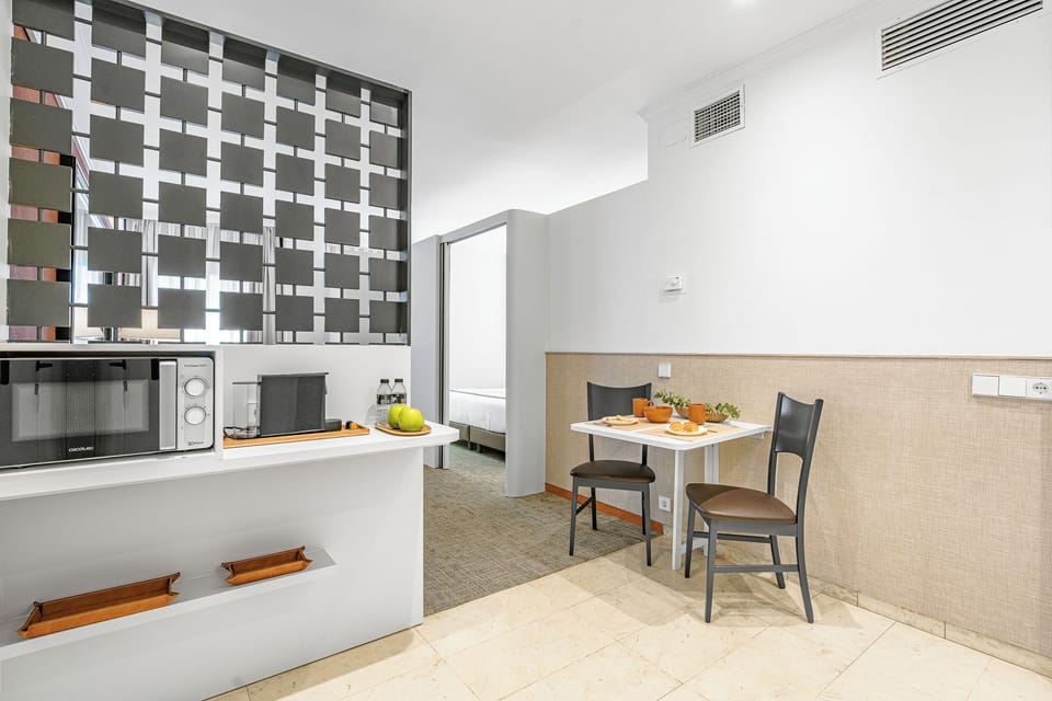 Superior Suite, Kitchenette | Private kitchen | Fridge, stovetop, electric kettle, cookware/dishes/utensils