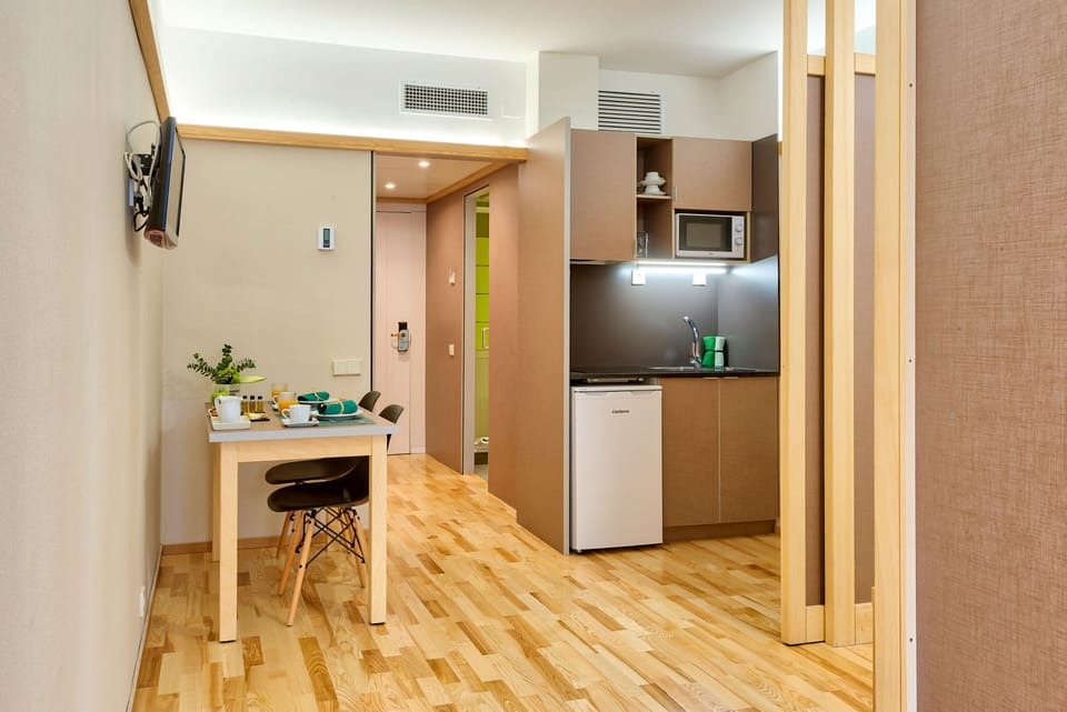 Standard Suite, Kitchenette | Minibar, in-room safe, desk, laptop workspace