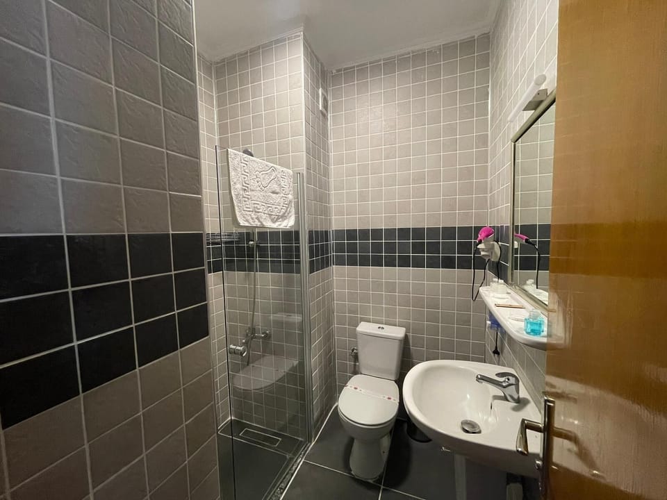 Shower, eco-friendly toiletries, hair dryer, slippers