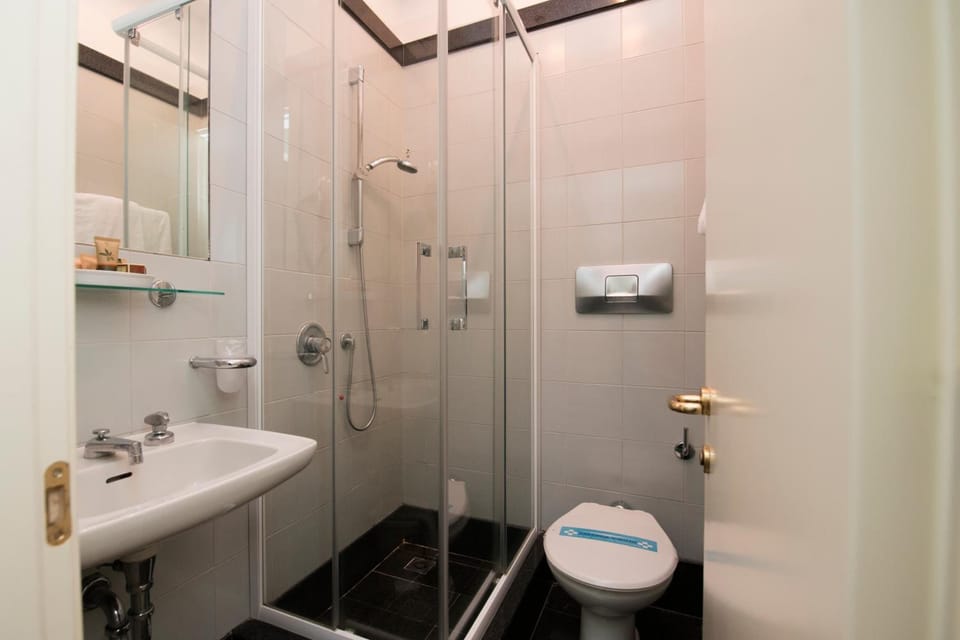 Shower, free toiletries, hair dryer, towels